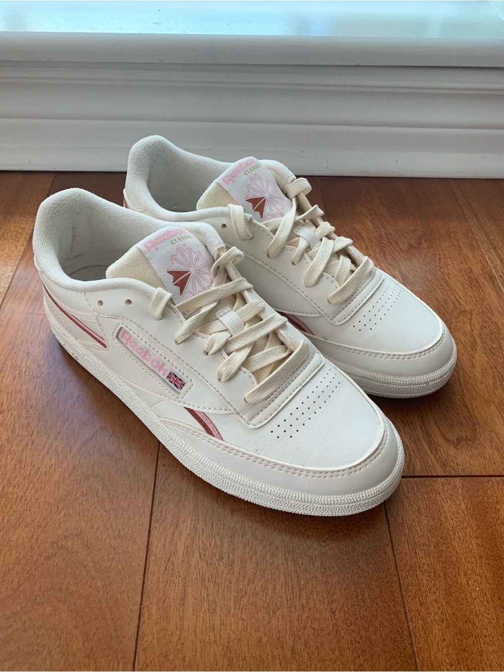 Women’s Reebok Classic Vegan Leather Sneaker in White with Pink Accents